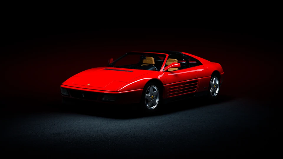 Red Ferrari 348 against a dark studio background